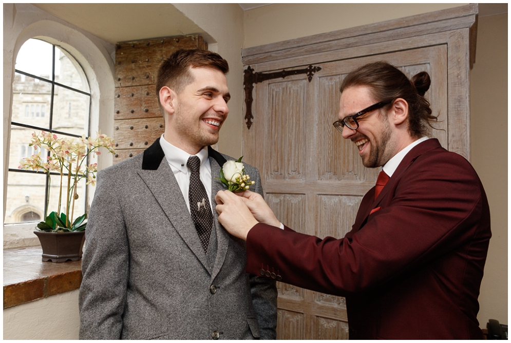 Best man helps groom with Buttonhole