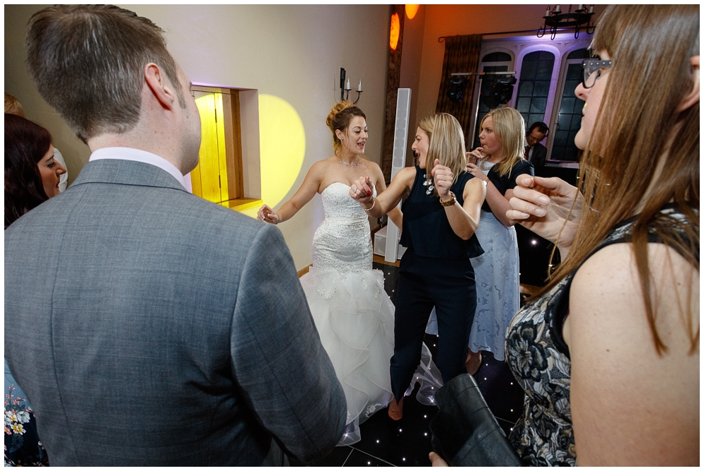 Bride dancing with girlfriends